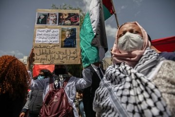 المشاركون في التظاهرات طالبوا البرلمان التونسي بتجريم التطبيع مع 