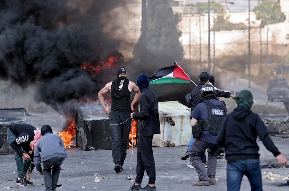 فلسطينيون يتصدون لاقتحامات الاحتلال في الضفة الغربية ( أ ف ب)