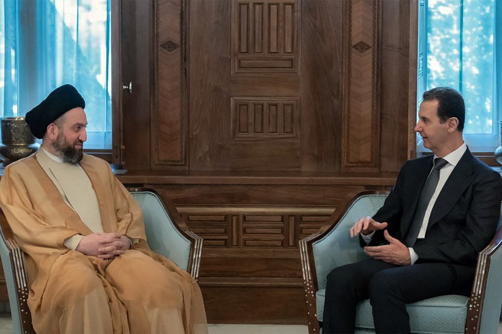 الرئيس السوري بشار الأسد مستقبلاً السيد عمار الحكيم في دمشق (أ ف ب)