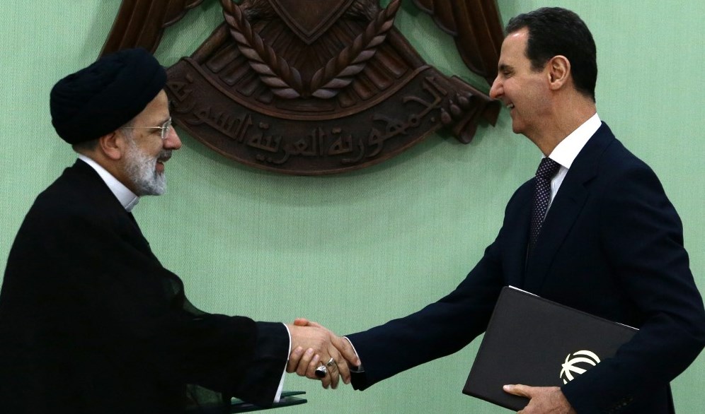 الرئيس السوري بشار الأسد ونظيره الإيراني ابراهيم رئيسي في دمشق 3 أيار/ مايو 2023 (أ ف ب).