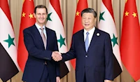 الرئيس الصيني شي جين بينغ، ونظيره السوري بشار الأسد في الصين