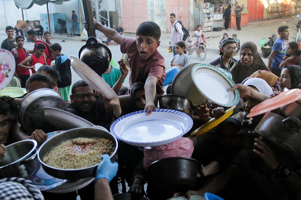 توزيع حصص الطعام، شمال قطاع غزة، 18 تموز/يوليو 2024 (رويترز)