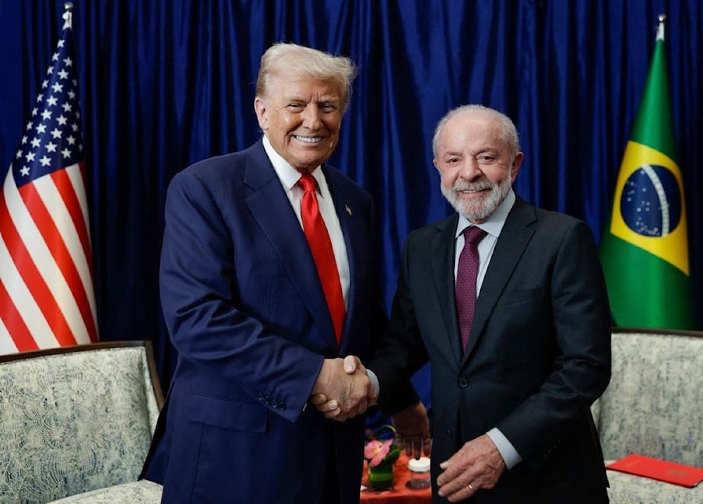 ترامب ولولا دا سيلفا خلال لقائهما في ماليزيا أمس (أ ف ب)