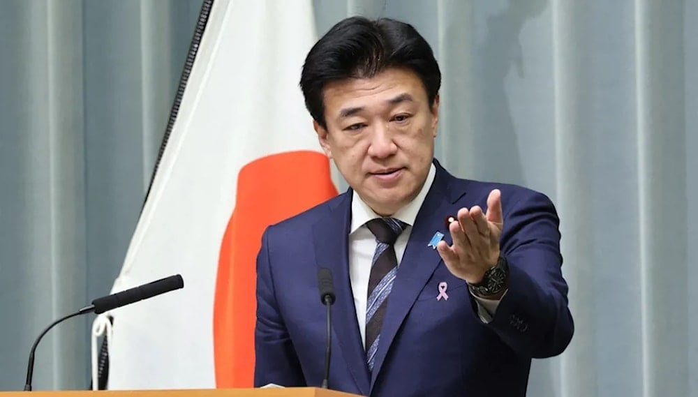 وزير شؤون مجلس الوزراء الياباني مينورو كيهارا (أ ف ب)