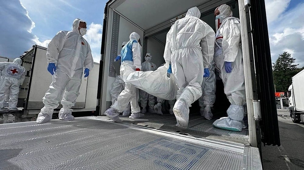 تبادل جثث روسي-أوكراني في ١٧ تموز/يوليو ٢٠٢٥ على الحدود بين بيلاروسيا وأوكرانيا (أ ف ب)