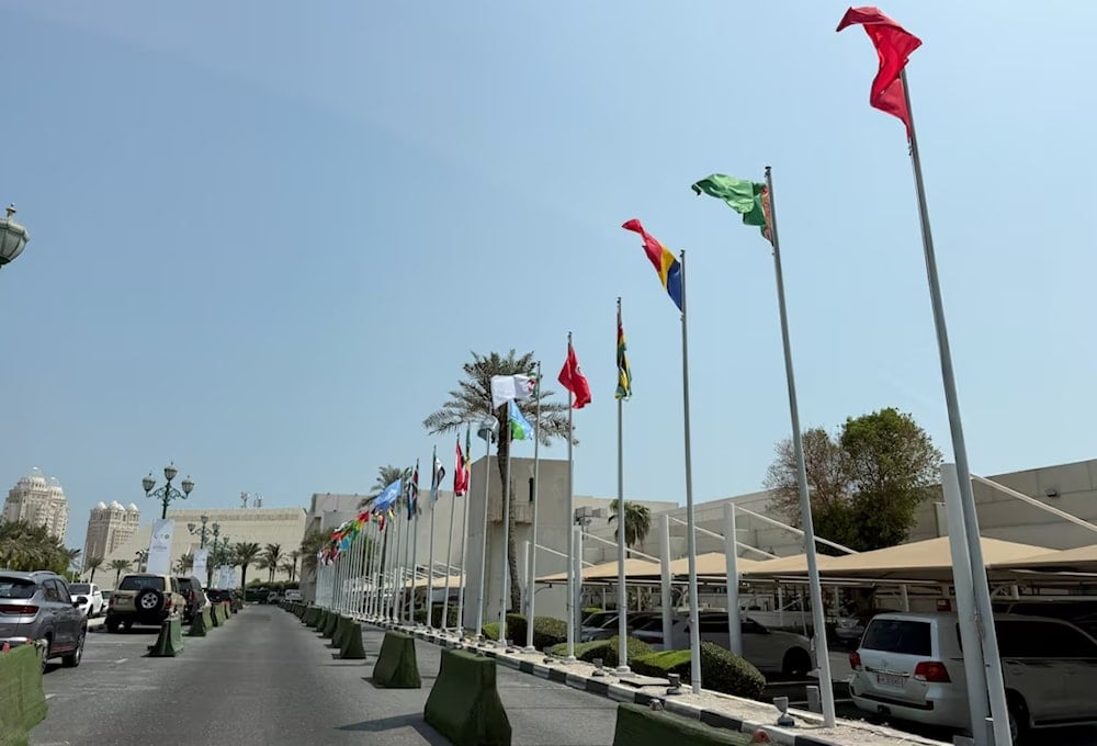 أعلام بعض من الدول المشاركة في القمة العربية الإسلامية الطارئة في العاصمة القطرية الدوحة (رويترز)
